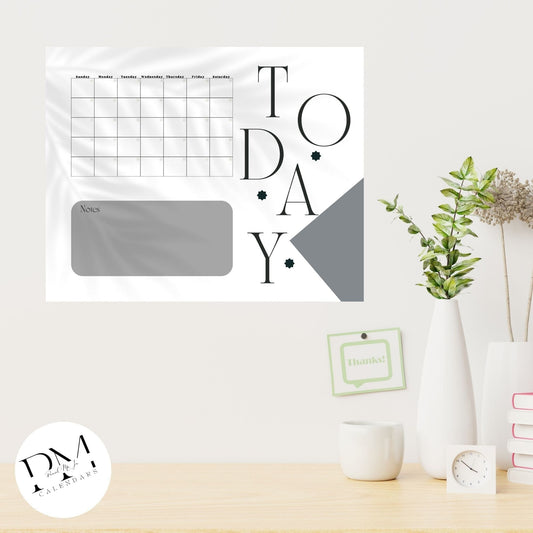 Grey Acrylic Calendar with floral shadow in the back. A Blank Monthly Calendar and a place for notes underneath. The word Today is written to the right of the calendar in black with dark grey block as decoration.